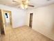 Bedroom with ceiling fan, closet, and tile floor at 534 Krysta Ln, Pahrump, NV 89060