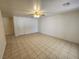 Spacious living room with tile flooring and ceiling fan at 534 Krysta Ln, Pahrump, NV 89060