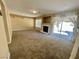 Bright living room features a fireplace and sliding glass doors to the backyard at 289 Helmsdale Dr, Henderson, NV 89014