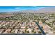 Neighborhood view showcasing houses with tile roofs and pools at 7410 Apple Springs Ave, Las Vegas, NV 89131