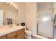 Bathroom with wood cabinets and a shower at 7410 Apple Springs Ave, Las Vegas, NV 89131