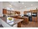 Well-equipped kitchen with granite countertops and wooden cabinetry at 7410 Apple Springs Ave, Las Vegas, NV 89131