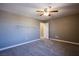 Bright bedroom with gray walls, carpet flooring and ceiling fan at 913 Evening Fawn Dr, North Las Vegas, NV 89031