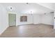 Light and bright entryway with light wood flooring and a sage green door at 3737 N Braewood Ave, Las Vegas, NV 89120