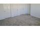 Well-lit bedroom with plush carpeting and ample closet space at 7332 N Decatur Blvd # 1, North Las Vegas, NV 89131