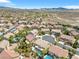 Aerial view of a luxury community with houses, pools, and lush landscaping at 3088 Via Flaminia Ct, Henderson, NV 89052