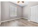 Bright bedroom with wood-look floors, plantation shutters, and a spacious closet at 3088 Via Flaminia Ct, Henderson, NV 89052