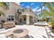 Home's exterior showcasing a spiral staircase and fire pit at 3088 Via Flaminia Ct, Henderson, NV 89052