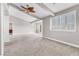 Main bedroom with high ceilings, large window, and carpet flooring at 3088 Via Flaminia Ct, Henderson, NV 89052