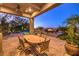 Outdoor patio dining area with pool and fire pit views at 2994 San Lorenzo Ct, Henderson, NV 89052