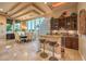 Home bar with granite countertop, wine storage, and mini-fridge at 2994 San Lorenzo Ct, Henderson, NV 89052