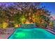 Inviting pool with fountain feature and lush landscaping at 2994 San Lorenzo Ct, Henderson, NV 89052