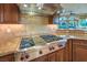 Upscale kitchen features granite countertops and stainless steel appliances at 2994 San Lorenzo Ct, Henderson, NV 89052