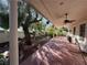 Long covered patio with view of backyard at 6080 Crystal Brook Ct, Las Vegas, NV 89149