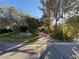 House entrance with gated driveway and lush landscaping at 6080 Crystal Brook Ct, Las Vegas, NV 89149