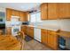 View of kitchen with wood cabinets, and white appliances at 9506 Golden Scots Ct, Las Vegas, NV 89123