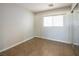 Simple bedroom with tile floors and mirrored closet at 9506 Golden Scots Ct, Las Vegas, NV 89123