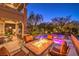 Outdoor firepit and seating area next to the pool at 2994 San Lorenzo Ct, Henderson, NV 89052