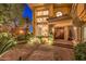 Elegant entryway with brick-paved courtyard and mature plants at 2994 San Lorenzo Ct, Henderson, NV 89052