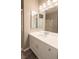 Bathroom with white vanity, a sink, and large mirrors at 9883 Russian Hill St, Las Vegas, NV 89141