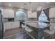 Modern kitchen with white cabinets, granite counters and island at 9883 Russian Hill St, Las Vegas, NV 89141