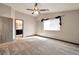 Main bedroom with ceiling fan and carpet flooring at 5740 Winter Cherry St, Las Vegas, NV 89130