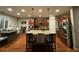 Modern kitchen with granite island, stainless steel appliances, and hardwood floors at 10314 Mount Oxford Ave, Las Vegas, NV 89166