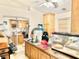 Kitchen with light wood cabinets and view into another room at 2281 Pampa Ave, Pahrump, NV 89048