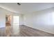 Bright hallway with light grey wood-look flooring at 601 Devonhall St # 202, Las Vegas, NV 89145