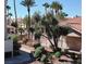 View of a community pool area with lush landscaping and trees at 601 Devonhall St # 202, Las Vegas, NV 89145