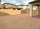 Large, unlandscaped backyard with block wall and patio at 9868 Angel Valley Dr, Las Vegas, NV 89178