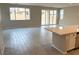 Open living space with grey tile floor and sliding glass doors at 9868 Angel Valley Dr, Las Vegas, NV 89178