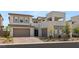 Two-story modern home with two-car garage and landscaped front yard at 472 Windstone Crest Ave, Las Vegas, NV 89138