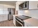 Modern kitchen with stainless steel appliances and white cabinets at 4787 E Beacon Ridge Dr, Pahrump, NV 89061