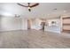 Open concept kitchen and living area with modern appliances and wood-look floors at 4787 E Beacon Ridge Dr, Pahrump, NV 89061