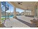 Expansive patio with pool, spiral staircase and seating at 1721 S Tioga Way, Las Vegas, NV 89117