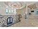 Open upper hallway with a chandelier and marble floors at 1721 S Tioga Way, Las Vegas, NV 89117