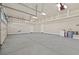 Large garage with high ceilings, epoxy flooring, and ample storage at 1721 S Tioga Way, Las Vegas, NV 89117