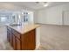 Open kitchen with island and views to living room at 3328 Kaniksu Ct, Las Vegas, NV 89122