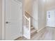 Modern staircase with white railing and carpeted steps, leading to the second floor at 4366 Landberg Ave, Las Vegas, NV 89141