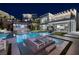 Luxury pool and patio with lounge chairs and city views at 659 Overlook Rim Dr, Henderson, NV 89012