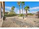 Desert landscaping with stone pathway and iron fencing at 3733 Budenny Dr, Las Vegas, NV 89122