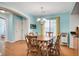 Dining room with hardwood floors and view of living room and kitchen at 6984 Smiling Cloud Ave, Henderson, NV 89011