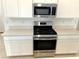 Stainless steel range and microwave in modern kitchen at 742 Monroe Hill Pl, Henderson, NV 89011