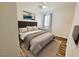 Spacious bedroom with large bed, wood floors, and window coverings at 1152 Bear Head St, Henderson, NV 89011