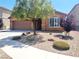 House exterior with landscaping, driveway, and two-car garage at 1152 Bear Head St, Henderson, NV 89011