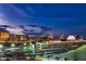 Aerial view of Las Vegas skyline at night, featuring the High Roller observation wheel at 205 E Harmon Ave # 912, Las Vegas, NV 89169