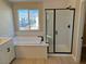 Spa-like bathroom with soaking tub and walk-in shower at 7207 Stockton Dunes St, North Las Vegas, NV 89084