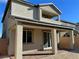 Two-story home with covered patio and landscaped backyard at 7207 Stockton Dunes St, North Las Vegas, NV 89084