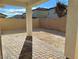 Private backyard with paved patio and sand landscaping at 7215 Stockton Dunes St, North Las Vegas, NV 89084